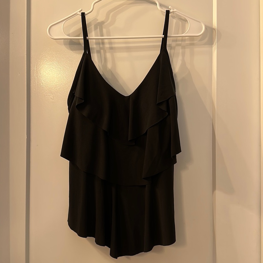 NWT! Cute black front-ruffled tankini top. Never been worn! Tags still attached.